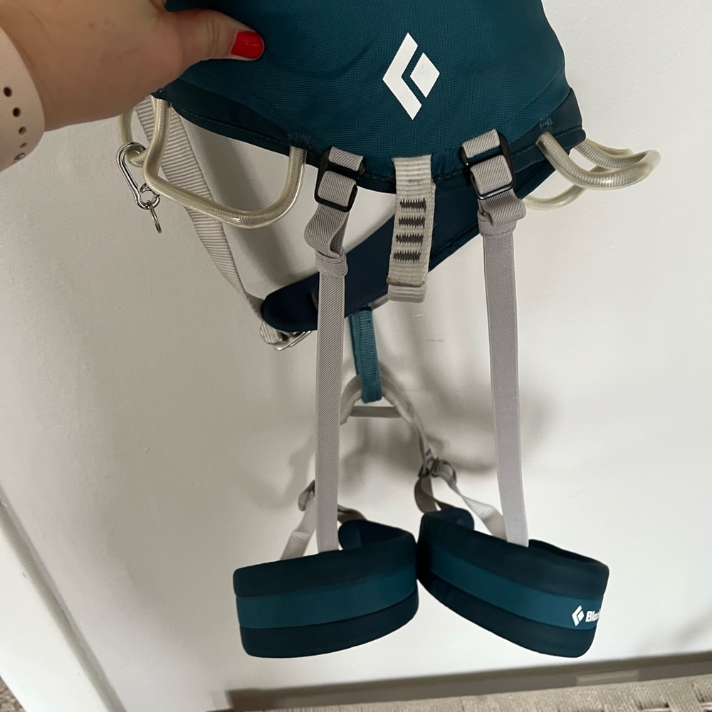 Black mountain climbing harness